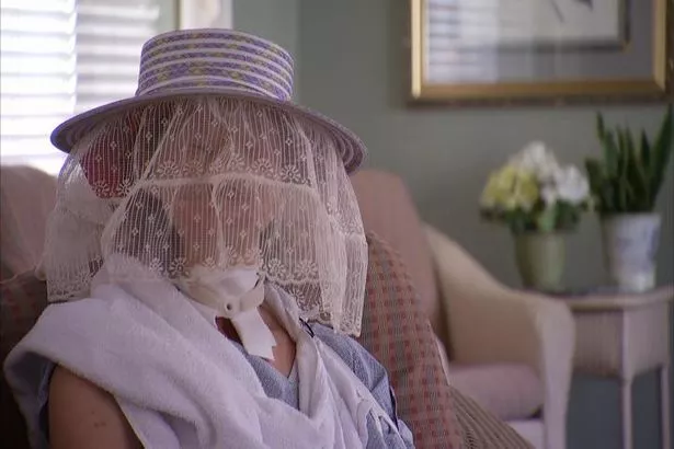 Charla appearing on Oprah Winfrey months after the incident with a veil covering her face