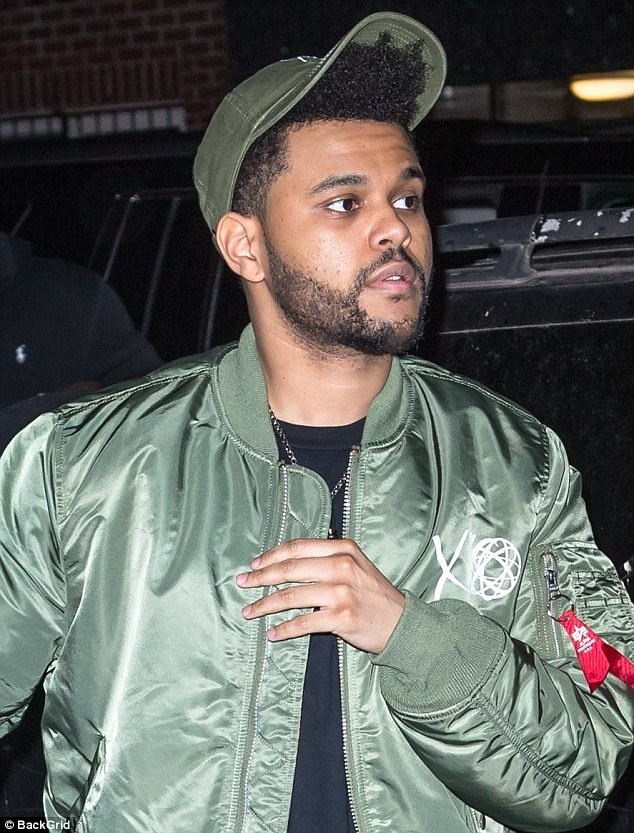 Contrast in styles: The singer, real name Abel Tesfaye, was wearing a much warmer outfit